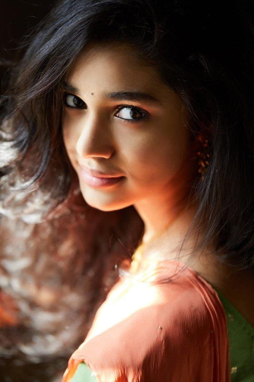 Krithi Shetty Portrait in Traditional Attire with Warm Lighting HD phone wallpaper
