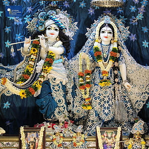 Radha Krishna Deities in Blue Attire with Floral Garlands and Silver Embroidery HD phone wallpaper