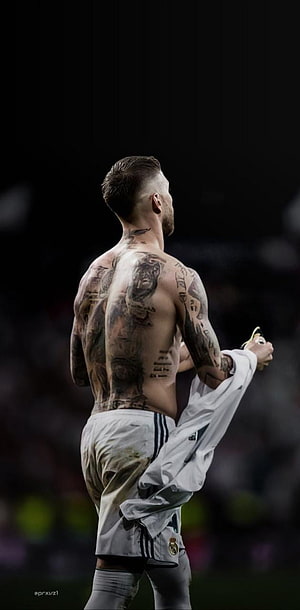 Sergio Ramos shirtless back view showing full body tattoos in Real Madrid kit HD phone wallpaper