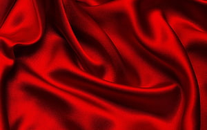 Deep Crimson Silk Fabric with Flowing Folds and Lustrous Satin Sheen HD wallpaper