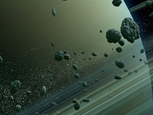 Asteroid Field Orbiting a Ringed Gas Giant Planet in Deep Space HD wallpaper