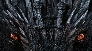 Game of Thrones Iron Throne Close-Up with Glowing Eyes and Dark Metallic Texture HD wallpaper