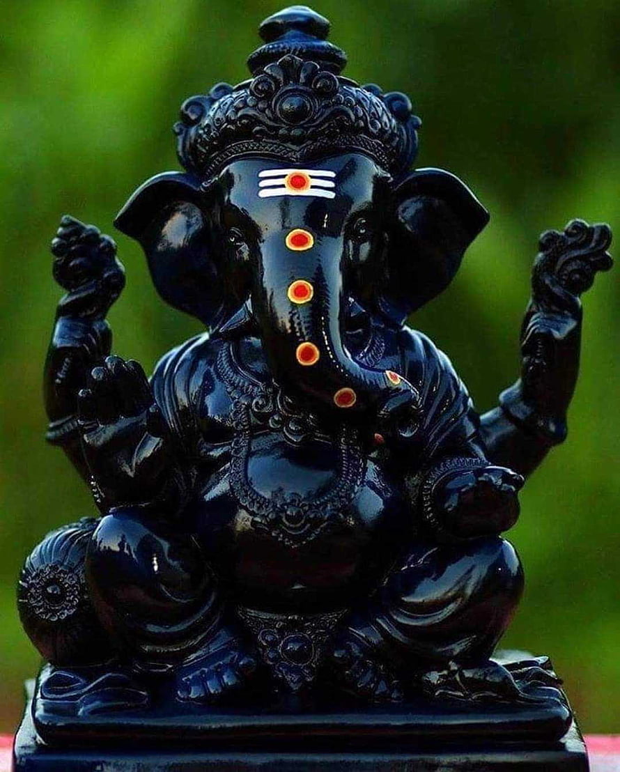 Black Obsidian Lord Ganesha Statue with Red Tilak and Ornate Crown HD phone wallpaper