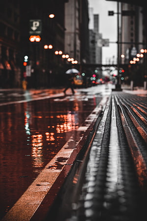 Moody Rainy Night City Street with Wet Crosswalk and Bokeh Lights HD phone wallpaper