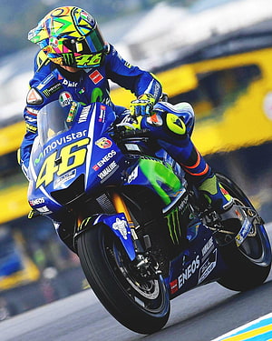 Valentino Rossi Leaning Into a Corner on His Movistar Yamaha MotoGP Bike HD phone wallpaper