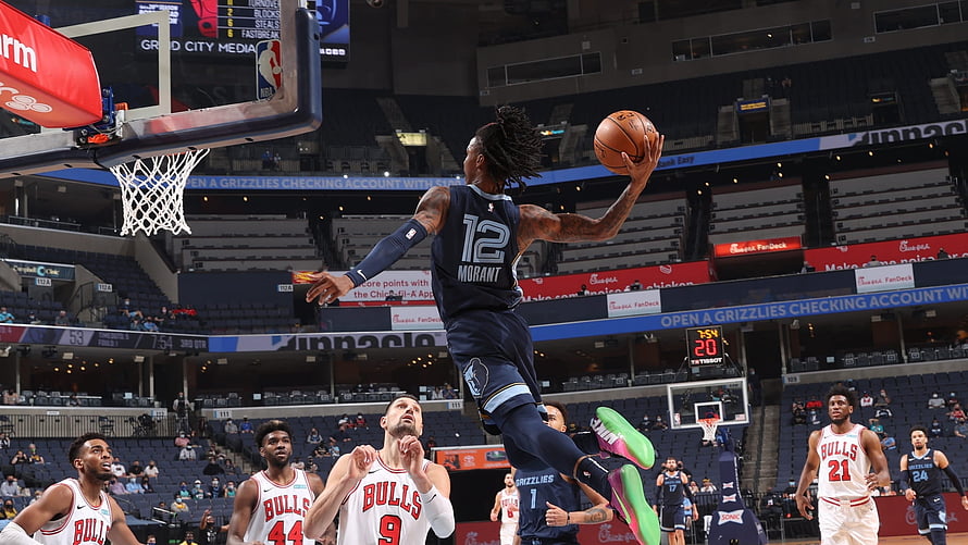 Ja Morant Memphis Grizzlies dunking against Chicago Bulls in NBA game action HD wallpaper