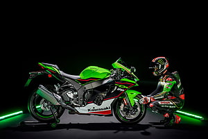 Kawasaki Ninja ZX-10R Green Motorcycle with Rider in Racing Gear HD wallpaper