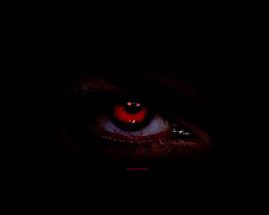 Menacing Red Eye Emerging From Pitch Black Darkness HD wallpaper