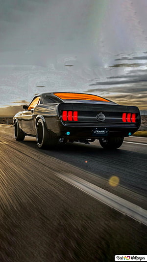 Black Ford Mustang Mach 1 Driving on Highway at Sunset HD phone wallpaper