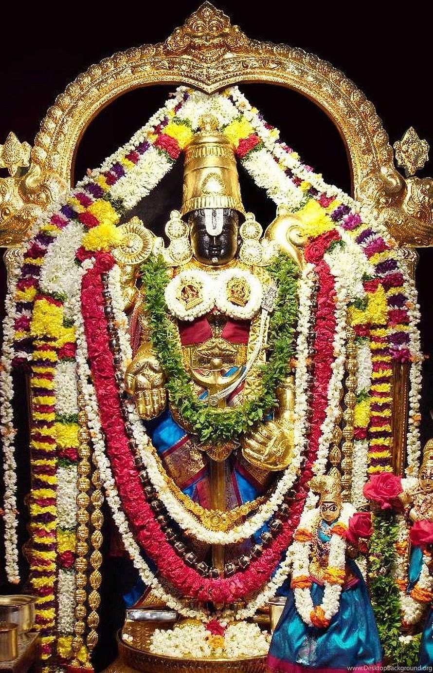 Lord Ayyappa adorned with vibrant flower garlands and golden ornaments in a temple shrine HD phone wallpaper