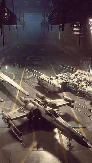 Star Wars X-Wing Fighter and TIE Interceptor Parked in a Dimly Lit Hangar Bay HD phone wallpaper