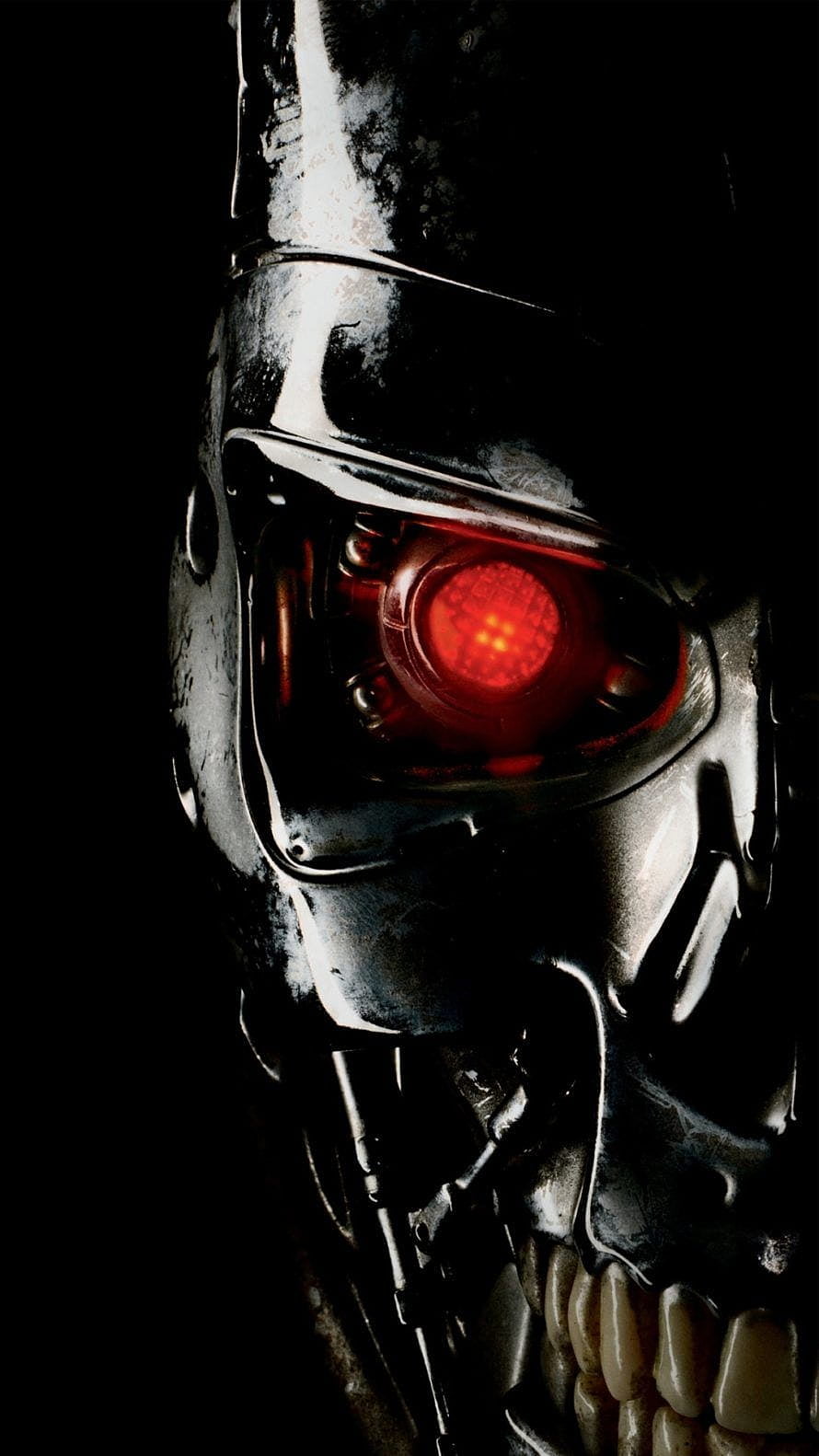 Close-up of the Terminator endoskeleton with glowing red optical sensor against a dark background HD phone wallpaper