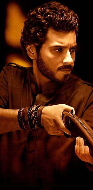 Munna Bhaiya Character Portrait with Curly Hair and Beaded Bracelets HD phone wallpaper