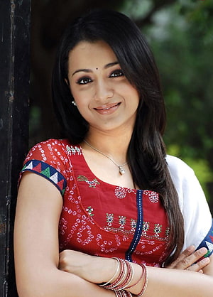 Trisha Krishnan in a red embroidered kurta with white dupatta and traditional bangles HD phone wallpaper