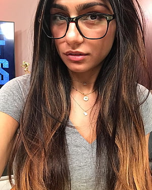 Mia Khalifa Close-Up Portrait Wearing Black Eyeglasses and Layered Gold Necklaces HD phone wallpaper