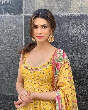 Kriti Sanon in a Yellow Floral Anarkali Suit with Traditional Jhumka Earrings HD phone wallpaper