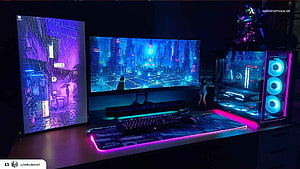 Neon-lit Cyberpunk Gaming Desk with RGB PC Tower and Ultrawide Monitor HD wallpaper