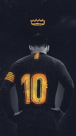 Lionel Messi wearing a black jersey with a glowing number 10 and a fiery crown above his head HD phone wallpaper