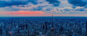 Shanghai Skyline at Dusk with Oriental Pearl Tower and Dramatic Clouds HD wallpaper