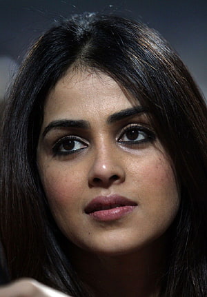 Genelia D'Souza Close-Up Portrait with Dark Hair and Intense Gaze HD phone wallpaper