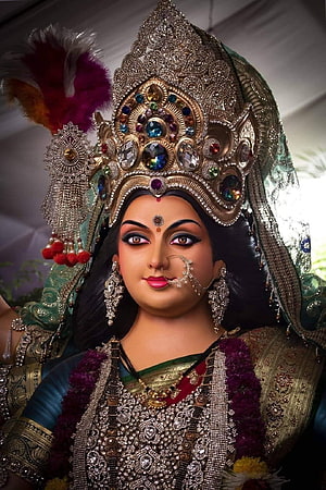Ornate Hindu Goddess Statue With Jeweled Crown And Traditional Jewelry HD phone wallpaper