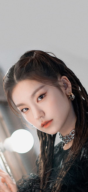 Yeji from ITZY in a moody close-up portrait with braided hair and a silver chain choker HD phone wallpaper