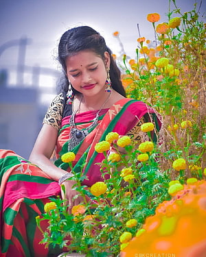 Woman in Traditional Saree Sitting Among Vibrant Marigold Flowers, santali girl HD phone wallpaper