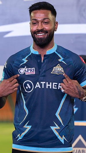Hardik Pandya Smiling In Gujarat Titans Cricket Jersey With Ather Sponsor Logo HD phone wallpaper