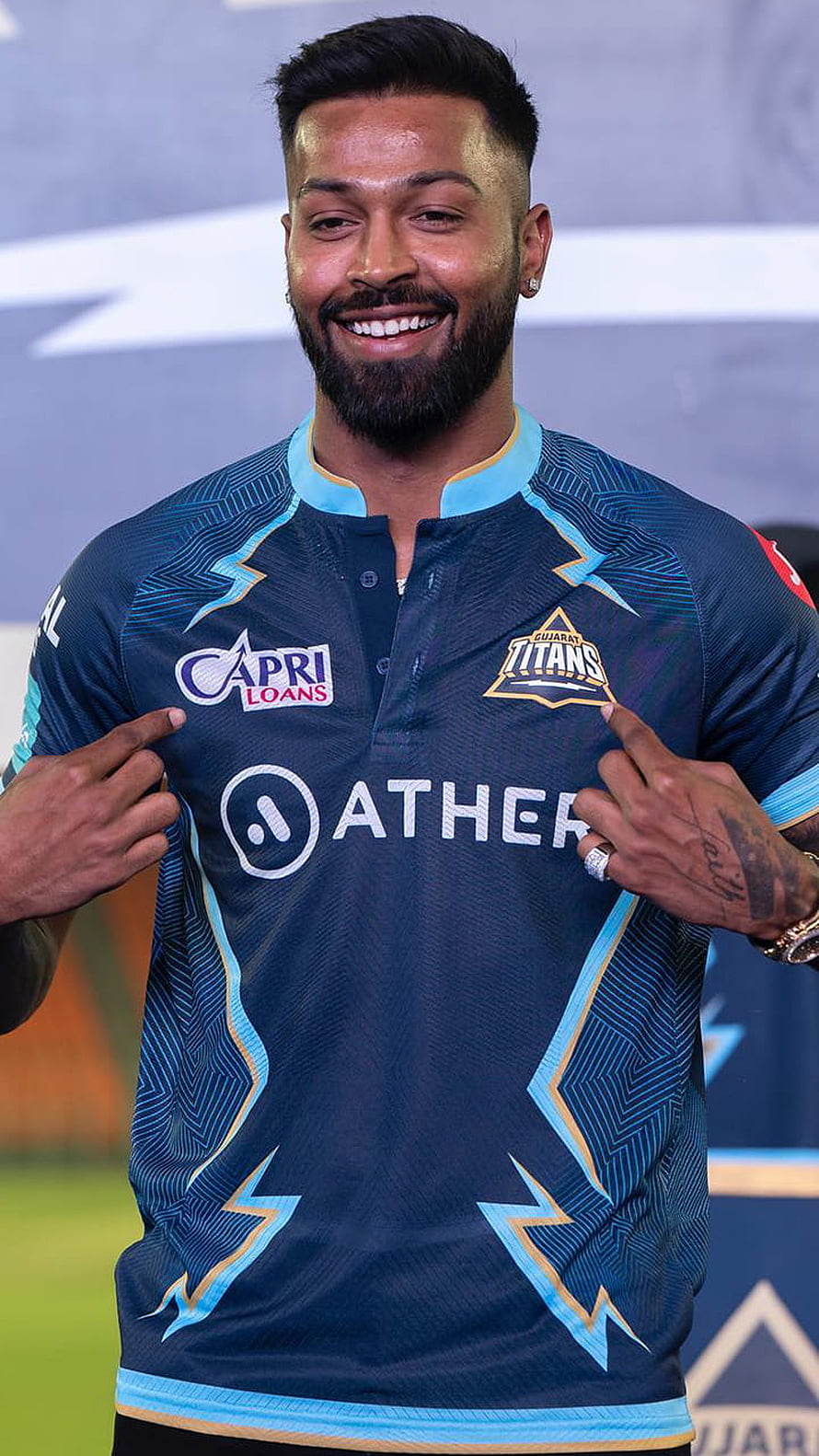 Hardik Pandya Smiling In Gujarat Titans Cricket Jersey With Ather Sponsor Logo HD phone wallpaper