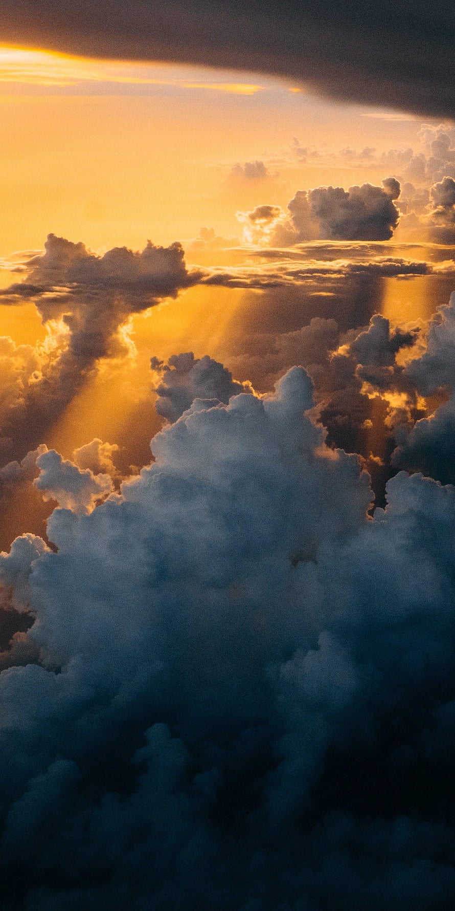 Golden Sunbeams Breaking Through Dramatic Cumulus Clouds at Sunset HD phone wallpaper