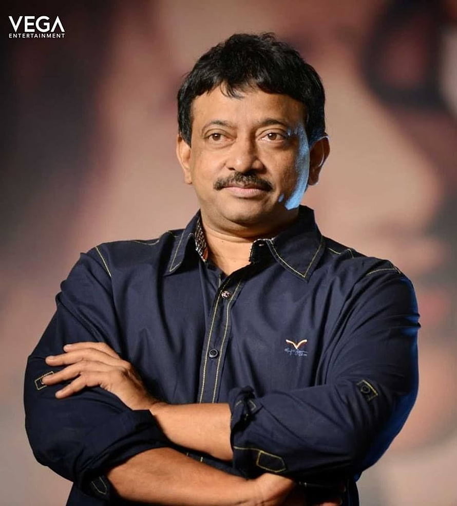Ram Gopal Varma Professional Portrait in Navy Blue Shirt with Arms Crossed HD phone wallpaper
