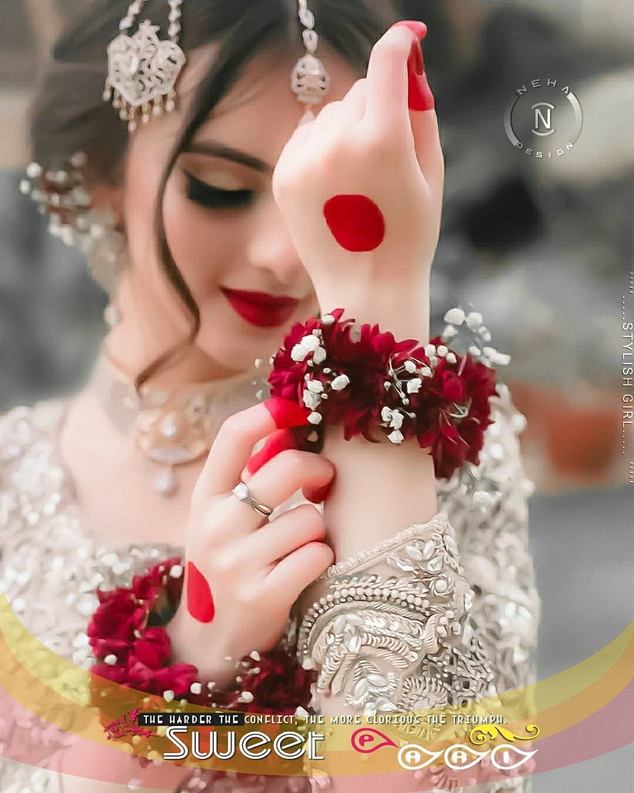 Elegant South Asian Bride in Silver Embroidered Attire with Floral Wrist Garlands and Traditional Jewelry HD phone wallpaper