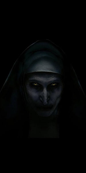 Eerie Ghost Nun Portrait with Glowing Yellow Eyes in Dark Hooded Veil HD phone wallpaper