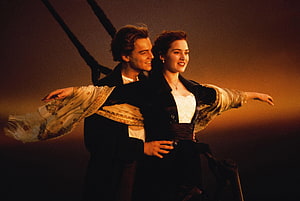 Titanic Jack and Rose Embracing on the Ship's Bow at Sunset HD wallpaper