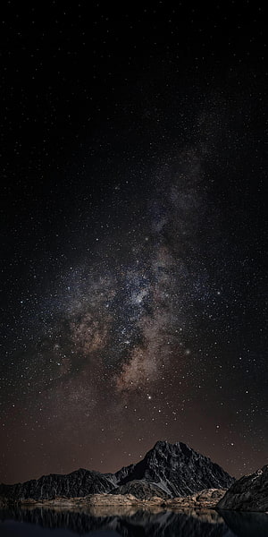 Milky Way Galaxy Rising Over Rugged Mountain Peaks With Calm Lake Reflection HD phone wallpaper