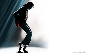 Michael Jackson Silhouette in Dynamic Dance Pose with Dramatic Stage Lighting HD wallpaper