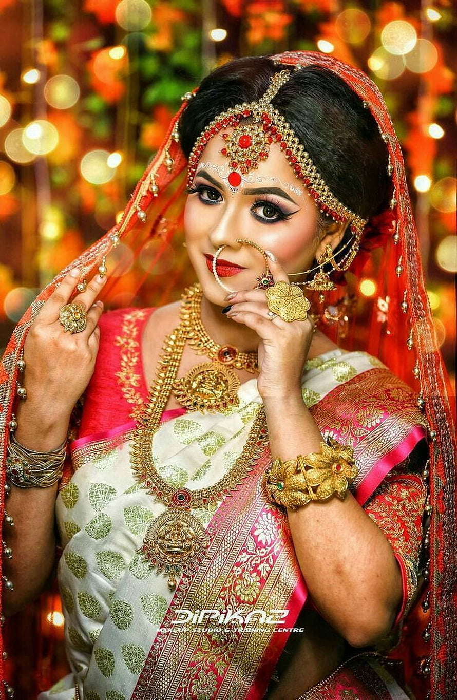 Indian Bride in White and Red Saree with Traditional Gold Jewelry and Nose Ring HD phone wallpaper