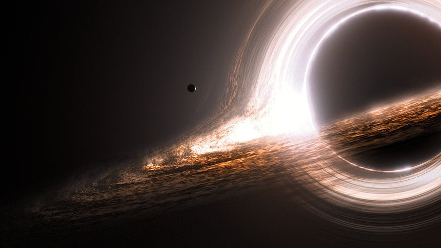 Interstellar Gargantua Black Hole with Accretion Disk and Planet HD wallpaper