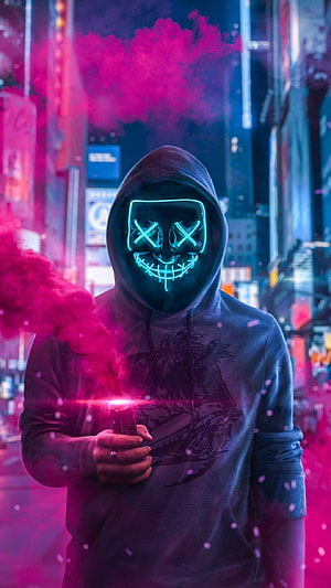 Anonymous Hacker in Neon Mask Holding Pink Smoke Bomb in Cyberpunk City HD phone wallpaper