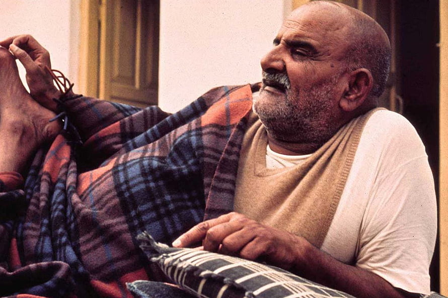 Neem Karoli Baba Portrait in Plaid Shawl and Beige Vest HD wallpaper