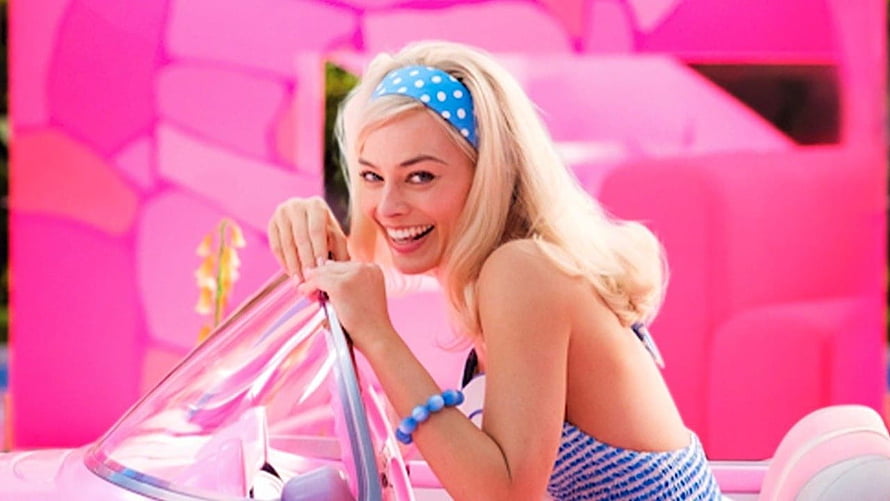 Margot Robbie as Barbie in a pink convertible with blue polka dot headband and vibrant pink background HD wallpaper