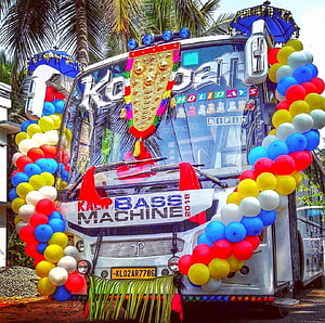 Kerala Decorated Tourist Bus with Colorful Balloons and Traditional Ornaments HD wallpaper