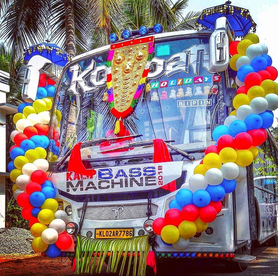 Kerala Decorated Tourist Bus with Colorful Balloons and Traditional Ornaments HD wallpaper