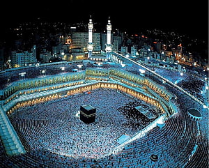 Aerial Night View of Kaaba in Mecca with Crowds Performing Tawaf HD wallpaper