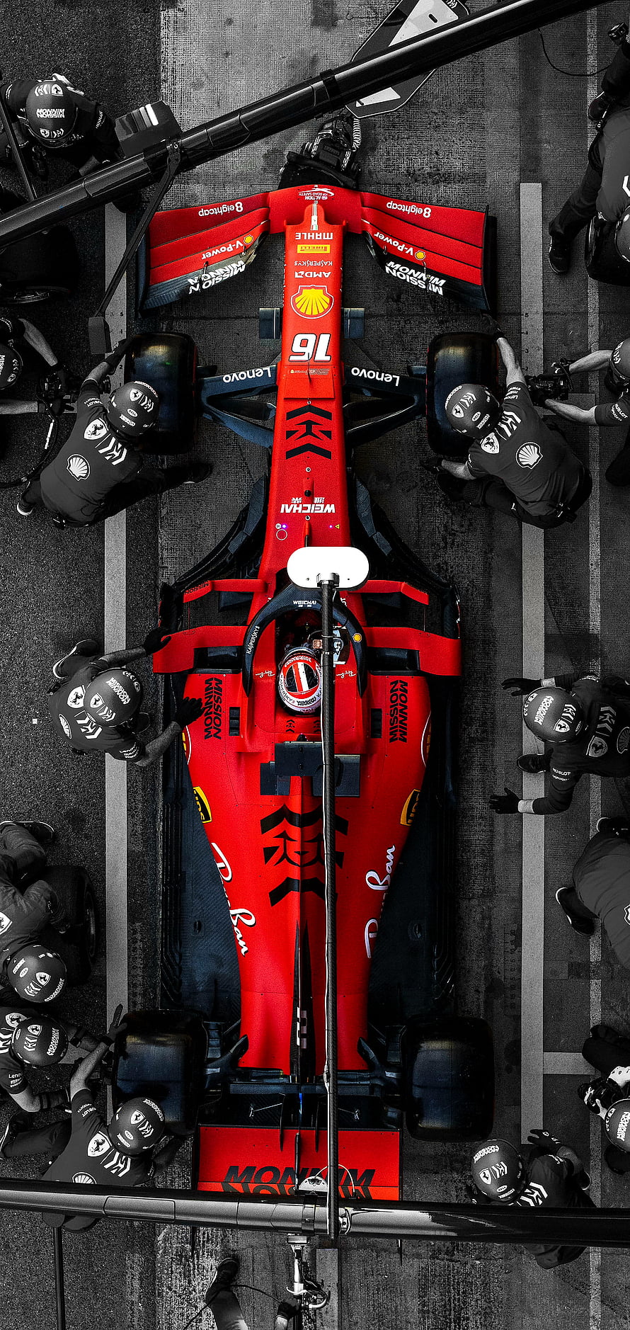 Top-Down View of Ferrari F1 Car in Pit Lane with Crew HD phone wallpaper