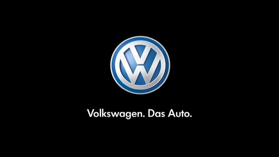 Volkswagen Emblem on Black Background with Das Auto Tagline HD wallpaper