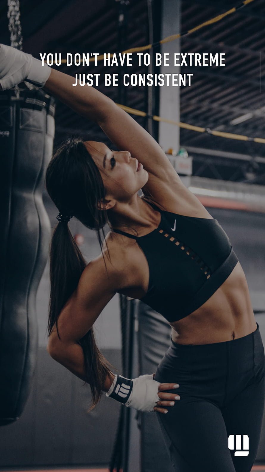 Female Athlete Stretching in Boxing Gym with Motivational Fitness Quote HD phone wallpaper