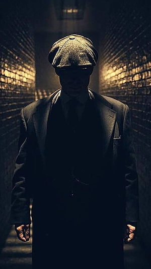 Peaky Blinders Character in Dark Alley with Flat Cap and Suit HD phone wallpaper
