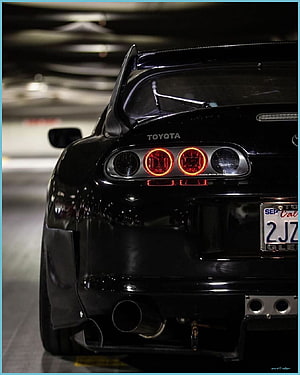 Black Toyota Supra Rear View With Halo Headlights And Carbon Fiber Spoiler HD phone wallpaper