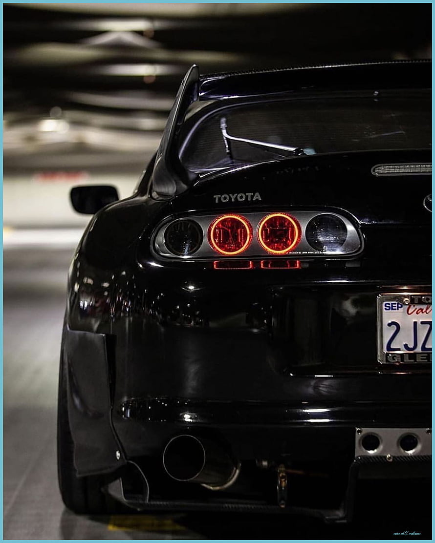 Black Toyota Supra Rear View With Halo Headlights And Carbon Fiber Spoiler HD phone wallpaper